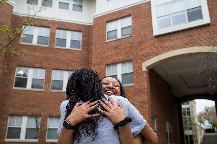 UMKC student Jennifer Rangel hugs one of her friends.